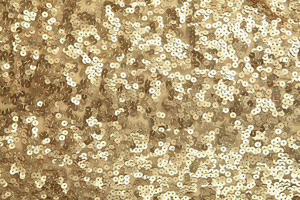 une image tres etiree de sequins dores
